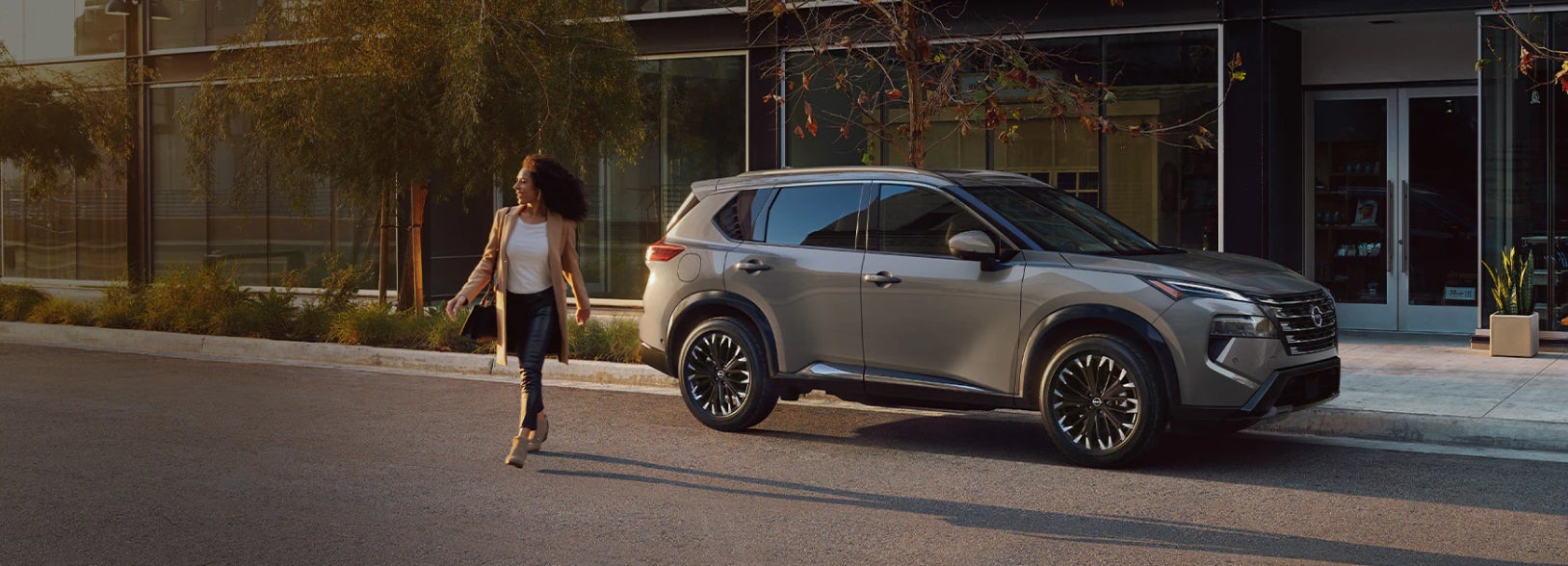 Lady walking away from their parked Nissan SUV