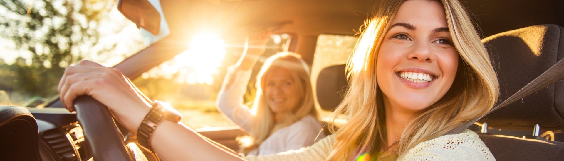 A family driving off in their new Nissan Vehicle